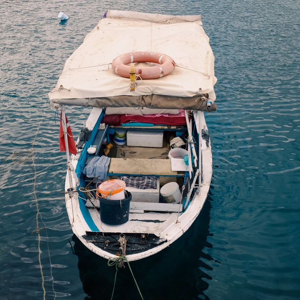 Three friends on a private charter boat anchored over a quiet patch reef.